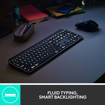 Logitech 920010923 wireless keyboard with illuminated backlit keys on desk with mouse and office supplies - FLUID TYPING, SMART BACKLIGHTING