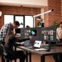 LG monitors in creative workspace with professionals collaborating on color grading and fashion design projects
