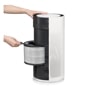 PFSCTA01 LG Air Purifier with person replacing cylindrical HEPA filter showing interior filter compartment