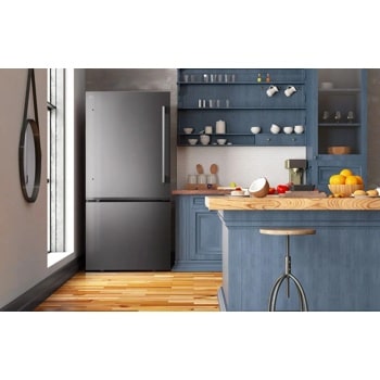 LG LB26H2200D Bottom Freezer Refrigerator in stainless steel finish integrated in modern blue kitchen with wooden countertop - Lifestyle Kitchen Setting