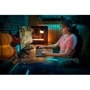 Gaming setup with Logitech 920012696 headset and keyboard in atmospheric room with teal and orange lighting - Lifestyle