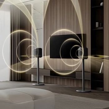 FS-M52 speakers with illuminated sound wave visualization showing audio projection in modern living room with wall-mounted TV