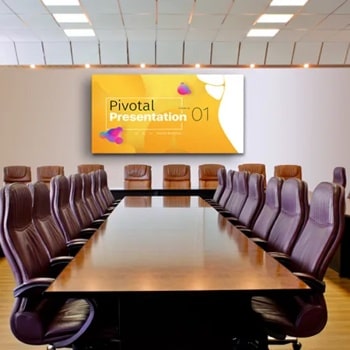 A large conference room with a long wooden table, leather chairs, and a presentation screen at the far end.1