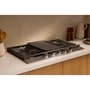 LG CBGU3639X Cooktop with gas burners and center griddle in modern kitchen setting