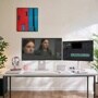 LG dual monitor setup for creative professionals with photo editing and video editing software on white desk
