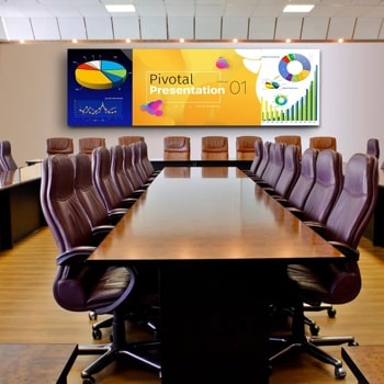 Modern conference room with a U-shaped table and digital screen displaying a presentation.1