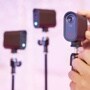 Logitech 961000500 webcams mounted on tripods with one in focus showing the Logi logo and red recording indicator