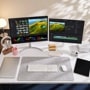 LG 32UP83AK-W and 27US550-W Monitors dual setup with video editing software on white desk workspace