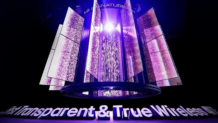 An LG OLED Transparent Screen installation glowing in purple lighting on a stage-like environment.
