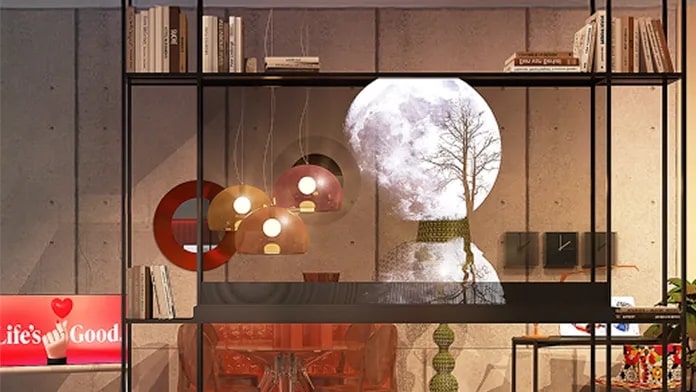 LG OLED Transparent Screen in a very modern setting with contemporary furniture, bookshelf and décor. An image of the moon is on the screen.