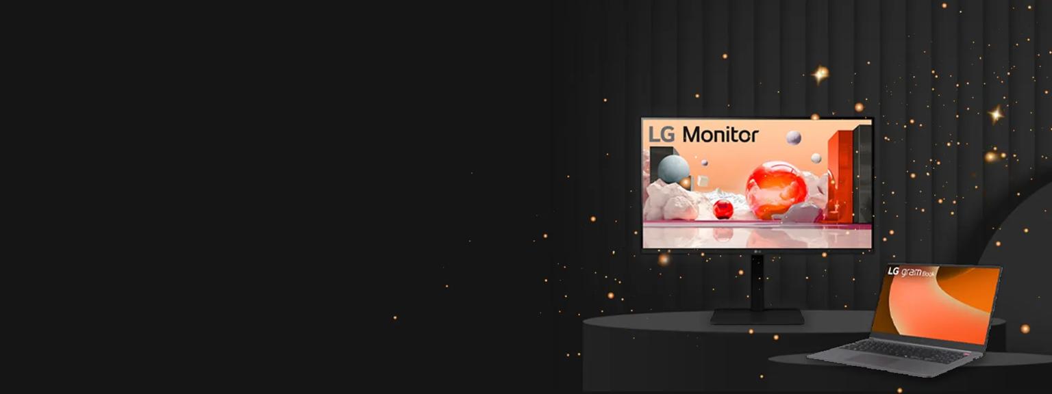 LG monitor and laptop on a dark background with gold sparkles cascading around them