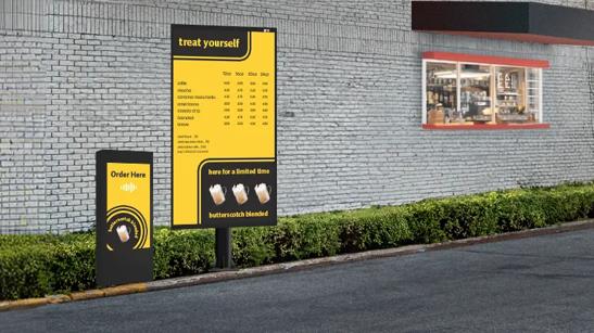 LG Drive Through digital signage outside of a cafe drive through, featuring bright menu for a coffee  quick serve restaurant.