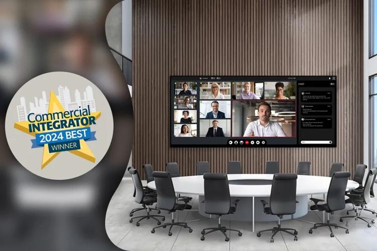 On the right side of the image, taking up most of the space, is a picture of a modern office meeting space with a circular table and an LG All in One DVLED display. On the display is a video call with many business people. To the left side of the office image is a beige circle, with a star award graphic that reads Commercial Integrator 2024 Best winner within it. Both of these images are set over a blurred background.