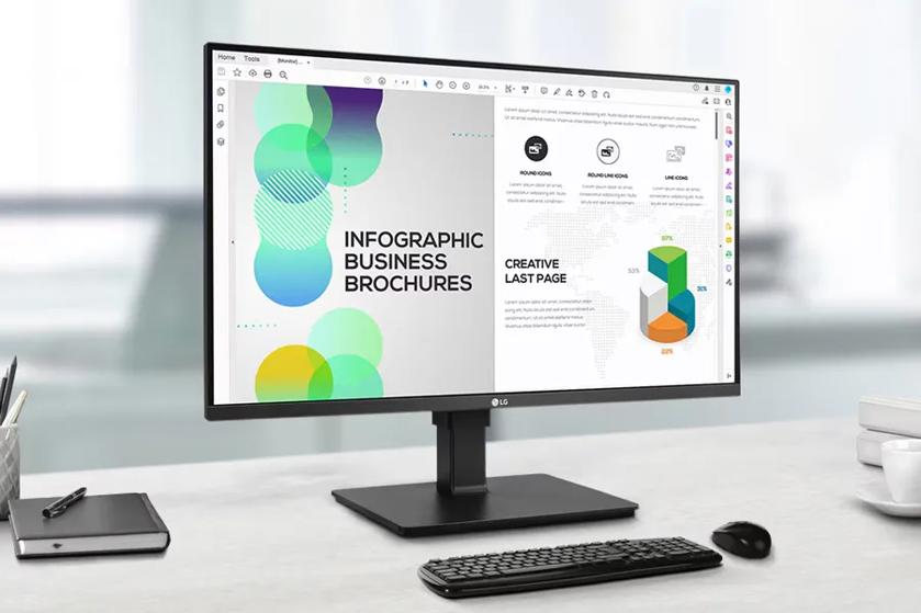 A computer monitor displaying an infographic and text document, set on a desk with a keyboard and mouse.