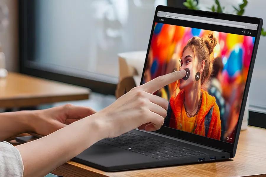 LG Gram 15Z90U-H.AU87U1 laptop with intuitive touchscreen feature showing finger interacting with vibrant display image