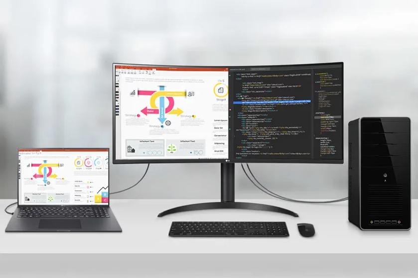 Workspace with a laptop, two monitors displaying an infographic and code, and a desktop tower.