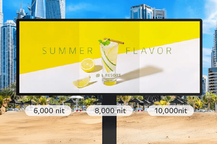 A digital billboard with an advertisement showing a summer drink and text "SUMMER FLAVOR @ L.RESORT", set against a cityscape with palm trees.