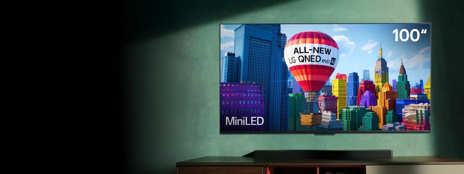 TV displays hot air balloon that reads “ALL-NEW LG QNED evo AI.” “100”” and “MiniLED” appear in corners of the TV.