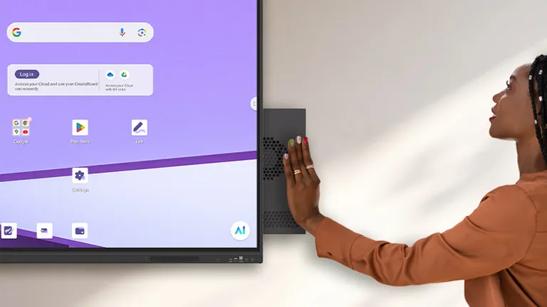A teacher inserts an OPS slot-in device into an LG CreateBoard