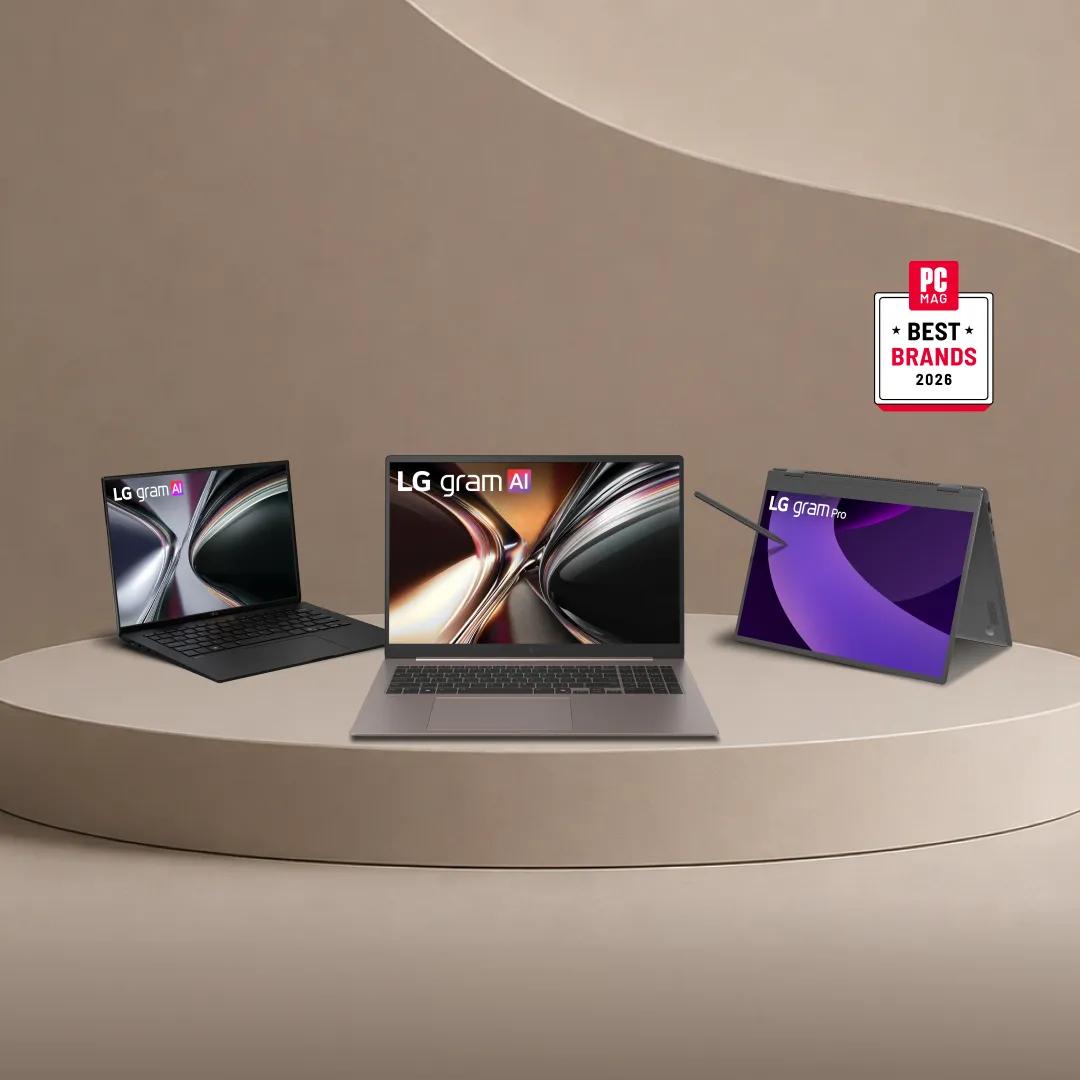 Three LG gram laptops (gram AI, gram AI, and gram Pro in 2-in-1 tent mode with stylus) displayed on a tan pedestal against a warm neutral background, each showing colorful abstract wallpapers. A "PCMag Best Brands 2026" badge appears in the upper right.
