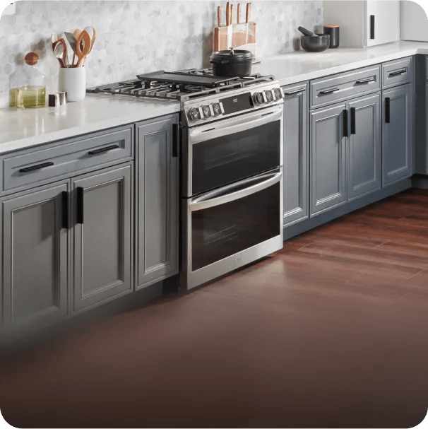 An LG slide-in range sits flush with the cabinets in a modern kitchen.