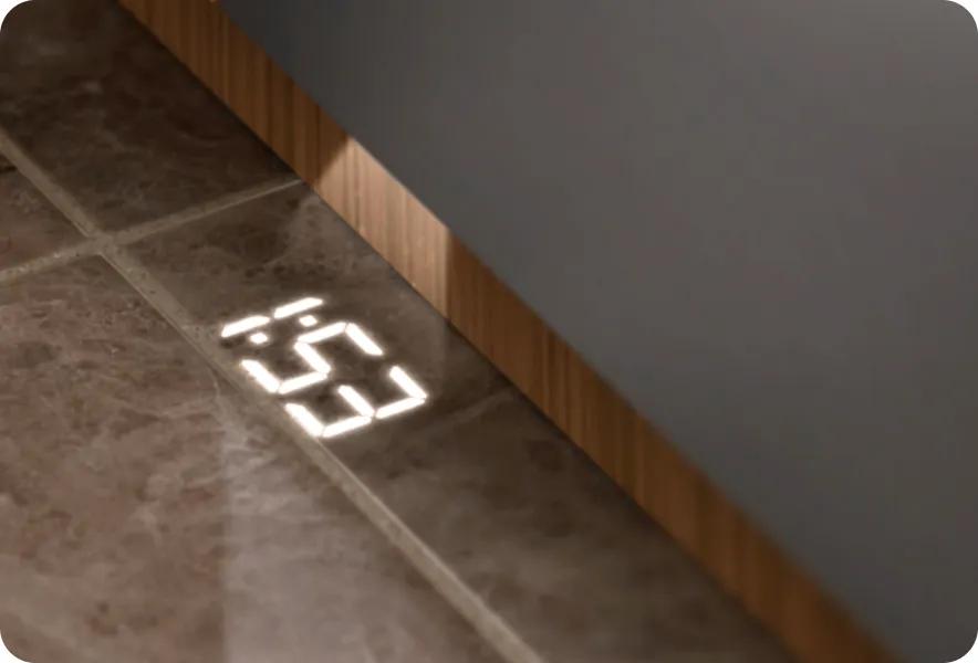 LG SIGNATURE Iconic Collection dishwasher with Floor Time Indicator Display projecting remaining cycle time onto kitchen floor.