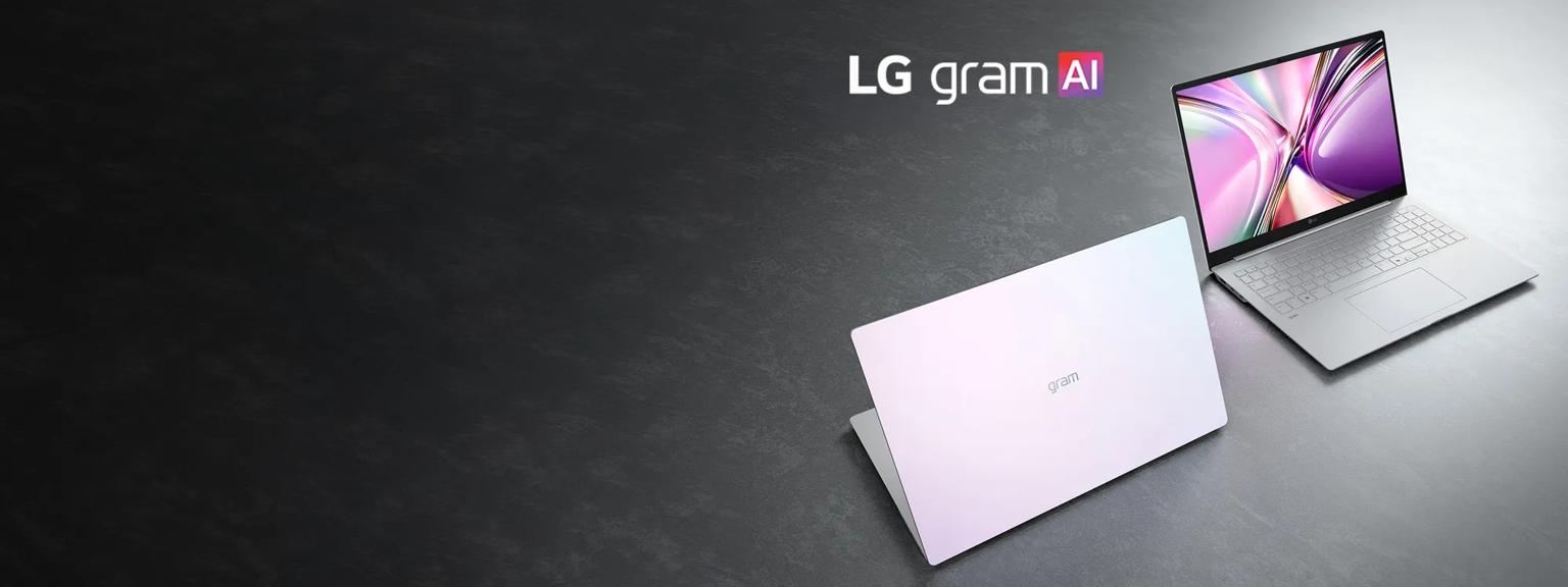 Two silver LG gram AI laptops on a dark surface, one closed and one open displaying a colorful abstract screen graphic.