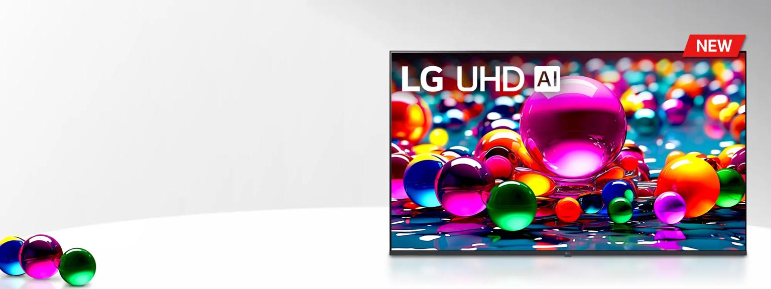 An LG UHD AI TV displaying a vibrant and colorful image of reflective, multicolored spheres of various sizes on a glossy surface. A red NEW label appears in the top corner of the screen.