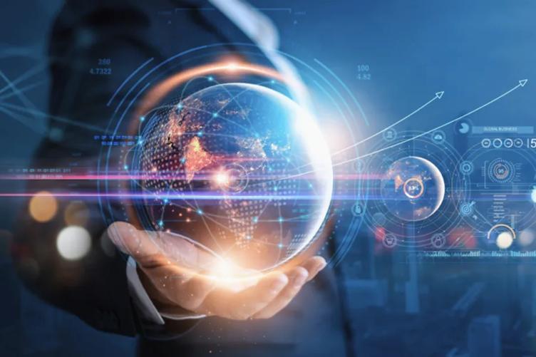 A person holding a holographic globe surrounded by digital data elements.