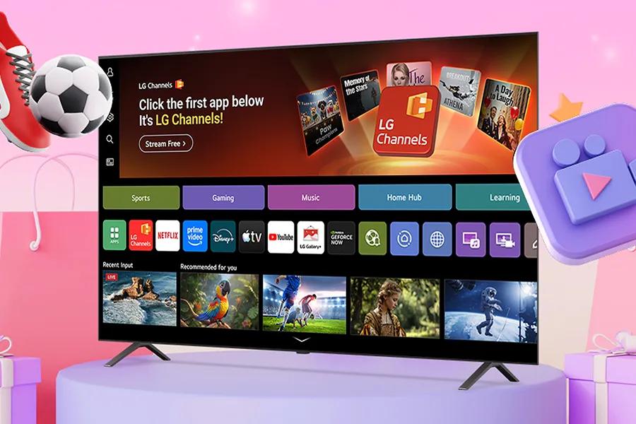 LG TV on a stand and on a pink background showing the webOS interface, with cgi versions of a soccer cleat, a soccer ball and a game controller in the frame.