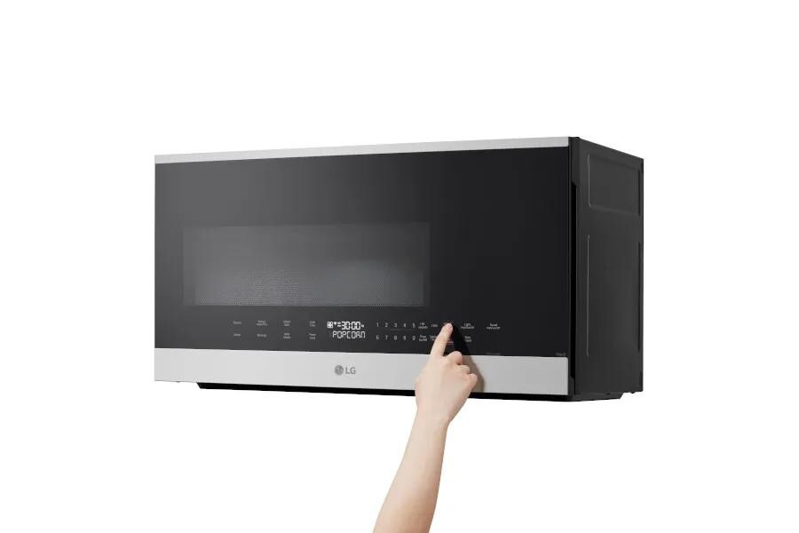 MVEL2034X product image with left hand pressing on controls